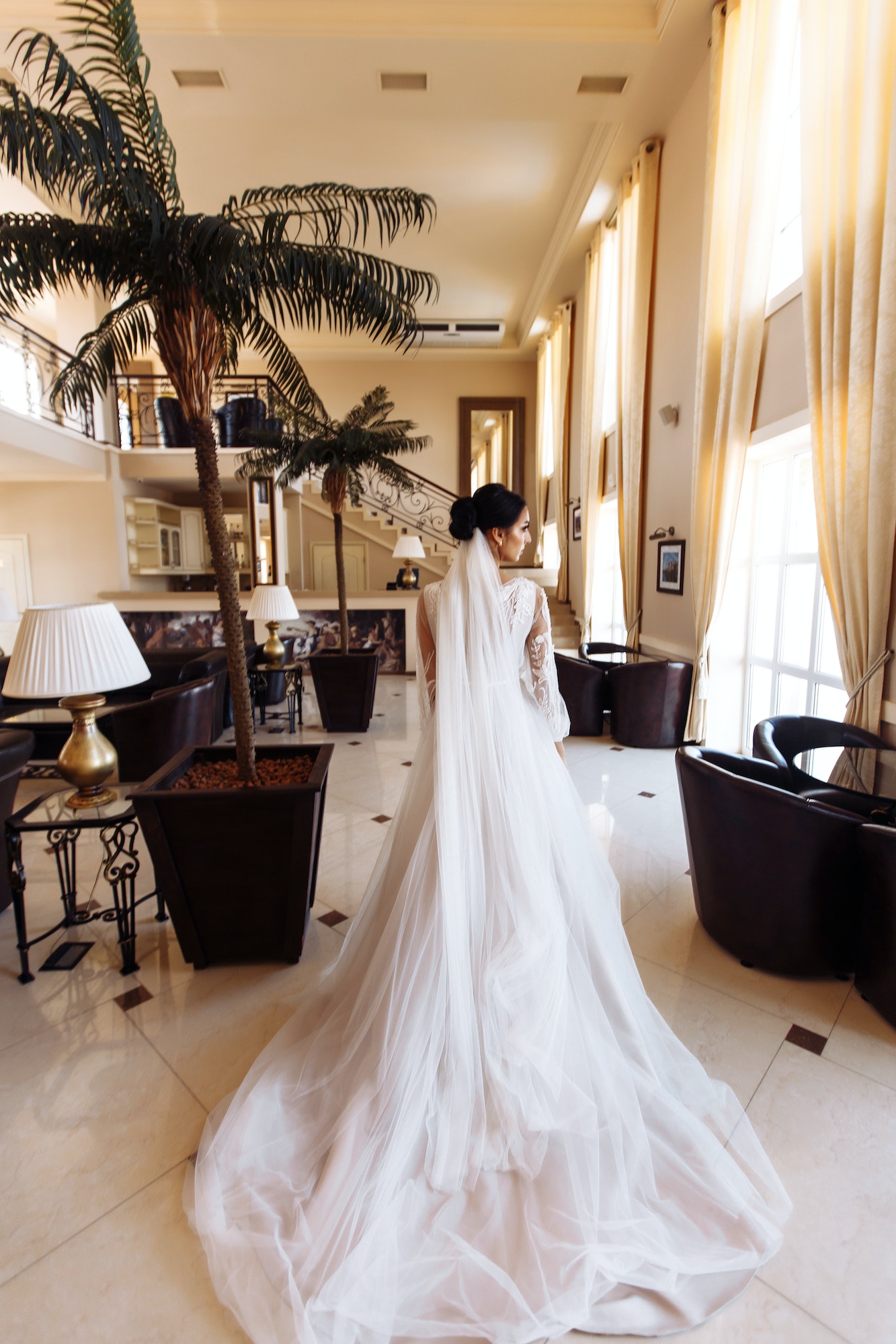 beautiful-bride-in-fashion-wedding-dress-with-a-long-luxury-veil-stunning-bride-is-incredibly-happy.jpg