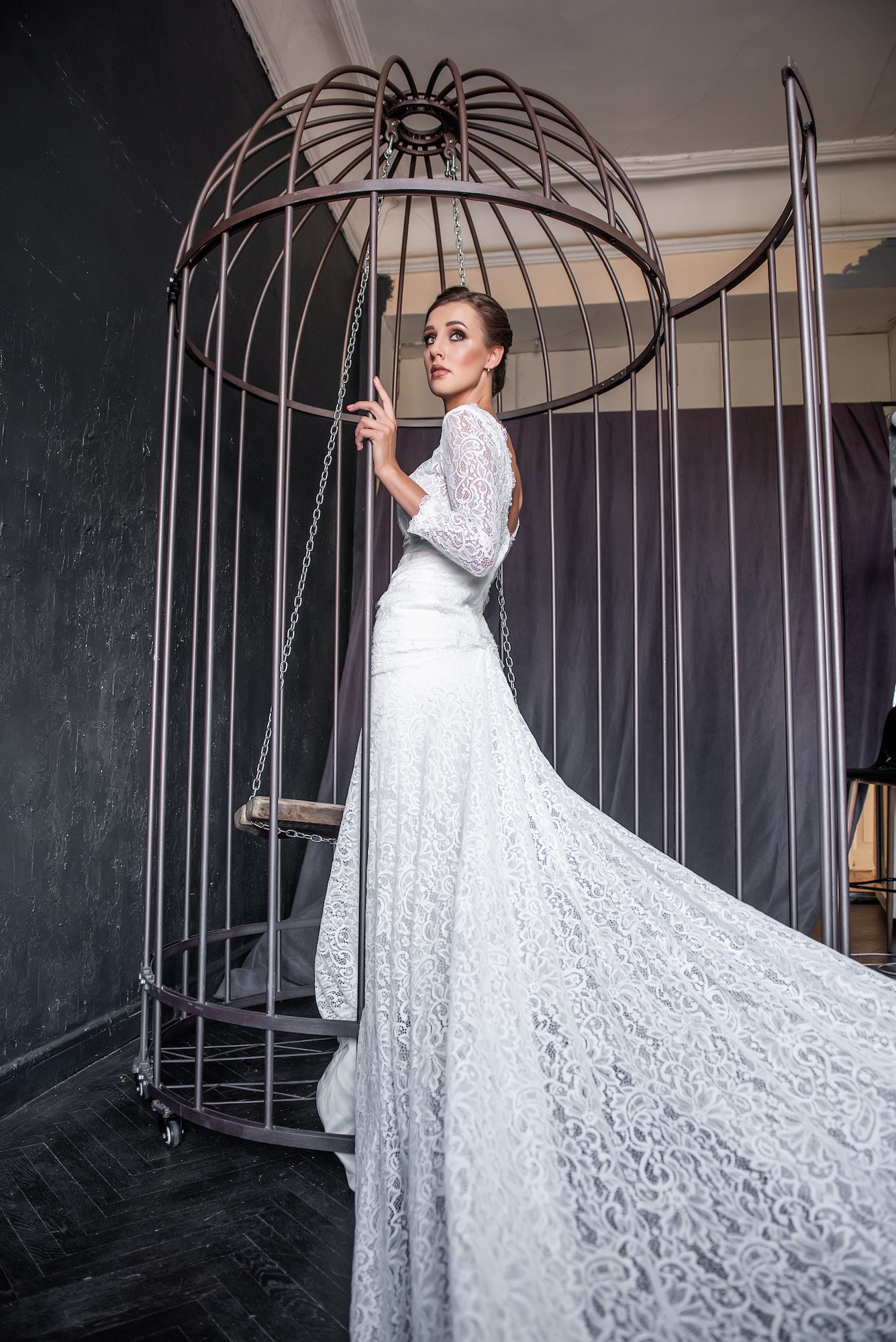 fashion-bride-in-an-iron-cage-unhappily-looking-out-from-behind-bars-life-out-of-will-.jpg